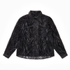 Sheer black wavy velvet patterned shirt on a white background