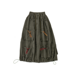 Green cargo skirt with multiple pockets on a white background