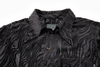 Black patterned shirt with a collar on a white background