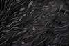 Black textured fabric with buttons