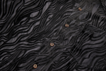 Black textured fabric with buttons