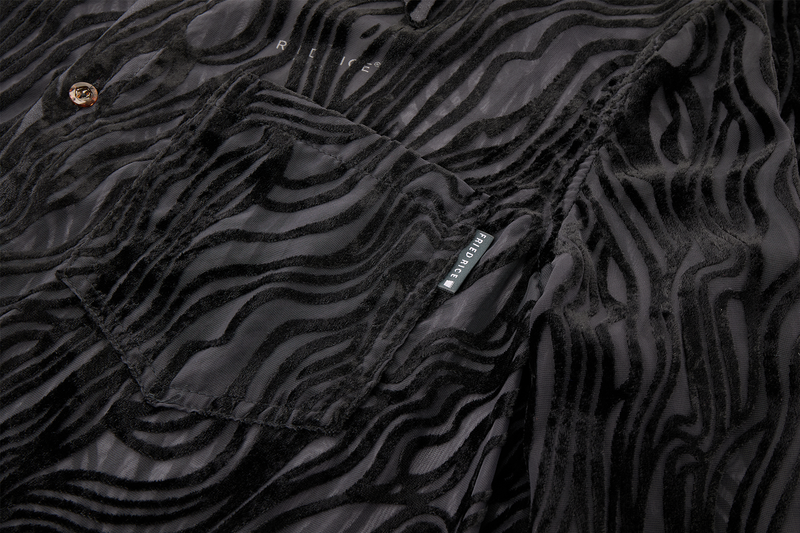 Close-up of a black textured fabric with a brand label.