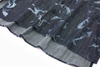 Close-up of a dark denim blue shirt with white abstract patterns hem