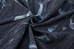 Close-up of dark denim blue fabric with subtle patterns