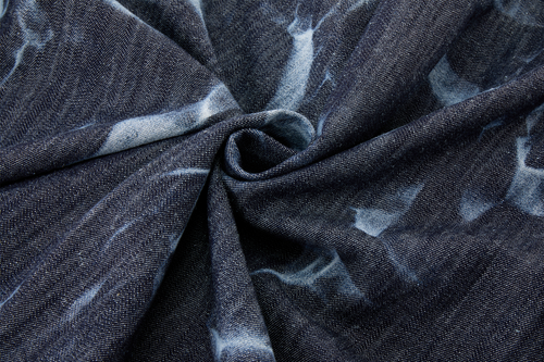 Close-up of dark denim blue fabric with subtle patterns