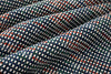Close-up of checkered fabric with blue, white, and red pattern
