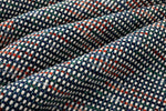 Close-up of checkered fabric with blue, white, and red pattern