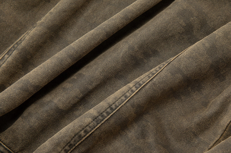 Close-up of brown fabric with suede brown camo wash