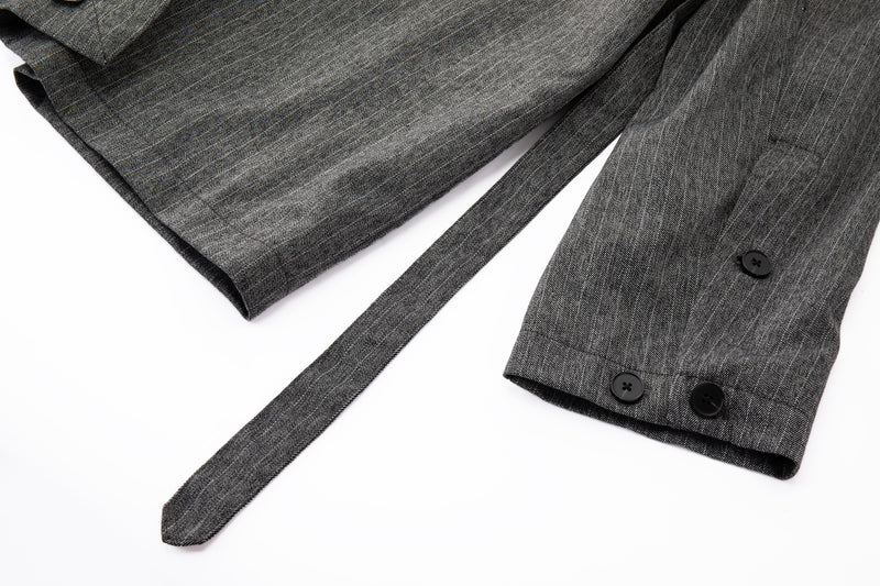 Gray wrap jacket with buttons and a tie